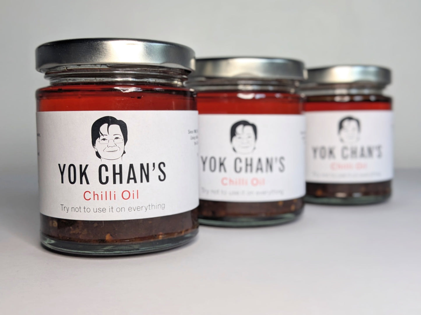 Three jars of Yok Chan's Chilli Oil in a row