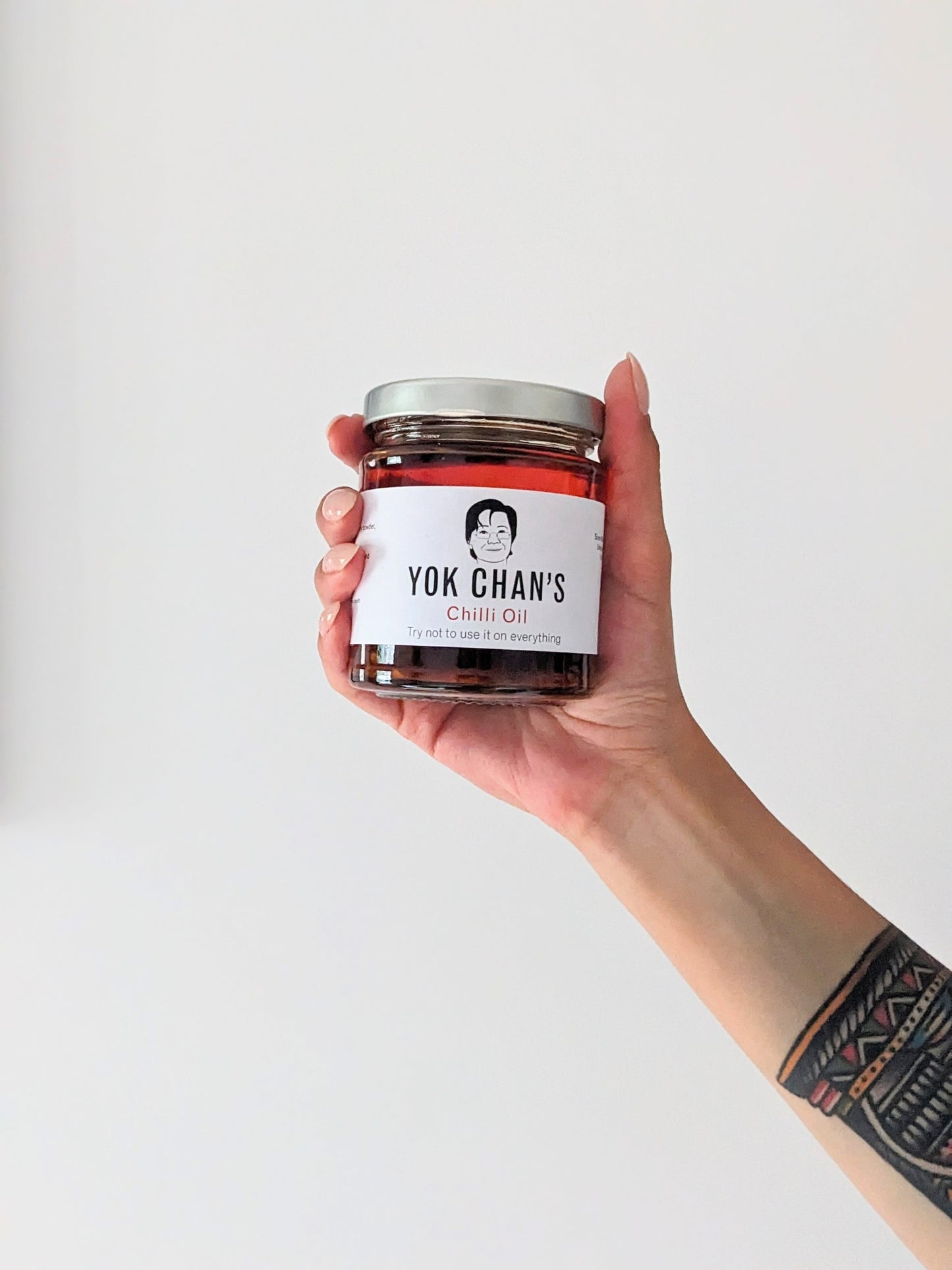 Yok Chan's Chilli Oil single jar in hand
